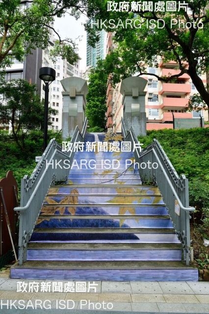 Season three of "City Dress Up: Blossoming Stairs", featuring 20 staircases in various districts adorned with autumn images, is now on display until September 30. Photo shows the staircase located at Hong Kong Park featuring "Autumn Leaves VIII" by Kan Kit-keung. The ink painting carries a distinct composition that features an overlapping foreground and background.