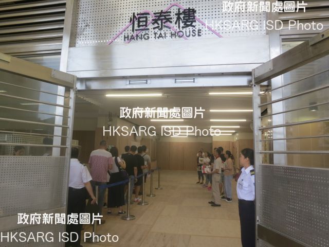The intake of tenants into the four newly completed blocks at On Tai Estate, Kwun Tong, began today (July 10). Photo shows residents completing the intake formalities.