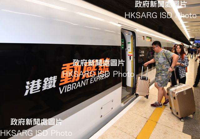 The Hong Kong Section of the Guangzhou-Shenzhen-Hong Kong Express Rail Link commenced operation today (September 23). The first train (G5736) departed from Hong Kong West Kowloon Station for Shenzhenbei Station at 7am. Photo shows passengers boarding the train.
