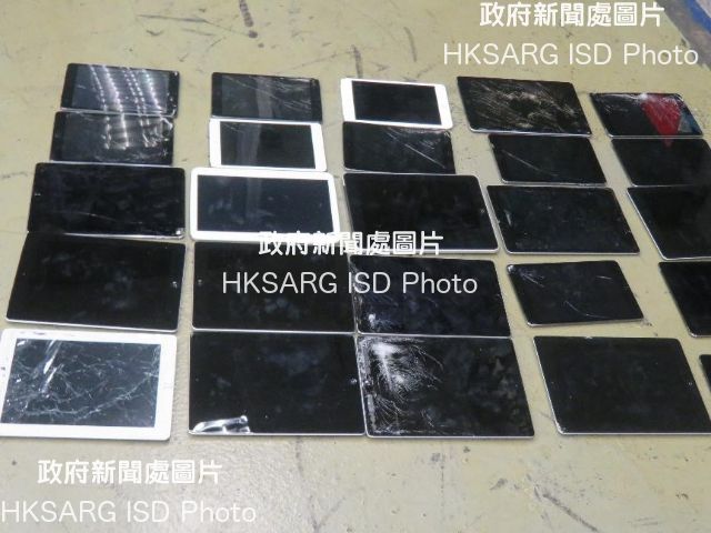 Illegally imported waste mobile phone displays and waste tablet displays were intercepted at Hong Kong International Airport by the Environmental Protection Department in November last year. Photo shows some of the seized waste displays.